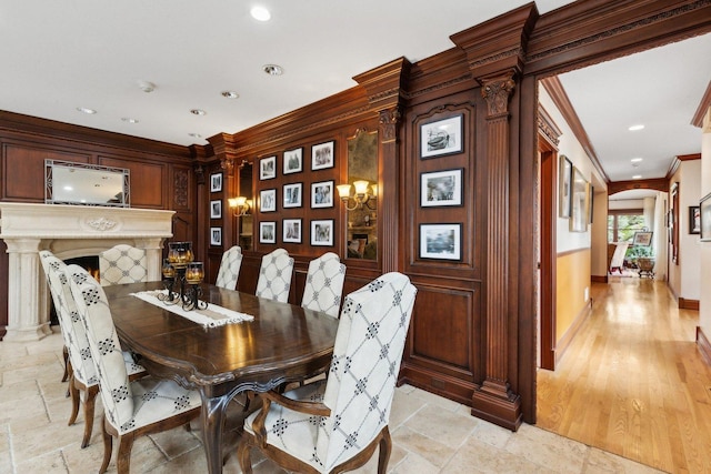 1424 Glencoe Ave, Highland Park, IL 60035 - dining area featuring crown molding, arched walkways, stone tile flooring, recessed lighting, and baseboards