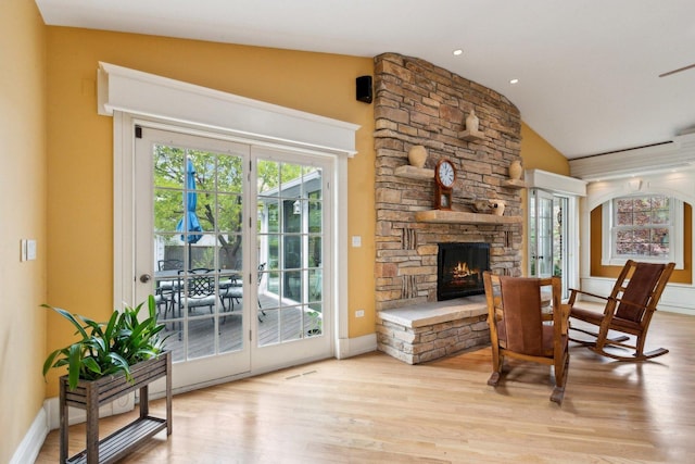 1424 Glencoe Ave, Highland Park, IL 60035 - living area with wood finished floors, a fireplace, lofted ceiling, and baseboards