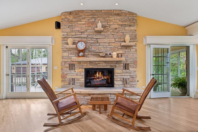 1424 Glencoe Ave, Highland Park, IL 60035 - living area featuring wood finished floors, a fireplace, and high vaulted ceiling