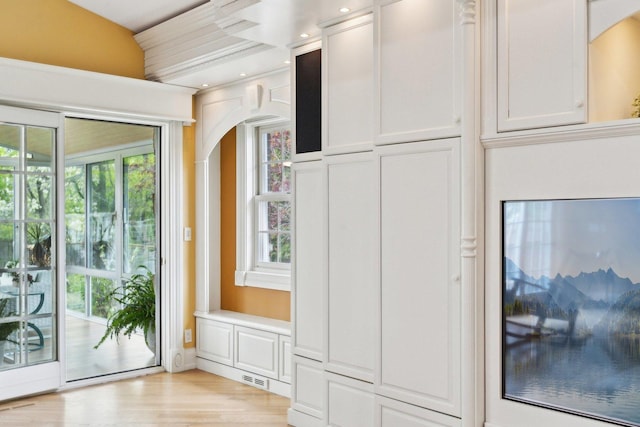 1424 Glencoe Ave, Highland Park, IL 60035 - doorway featuring arched walkways, healthy amount of natural light, and light wood finished floors