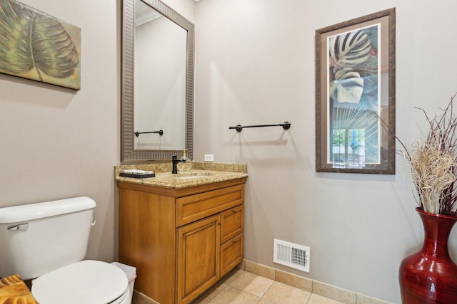 1424 Glencoe Ave, Highland Park, IL 60035 - half bath with toilet, vanity, tile patterned flooring, and baseboards