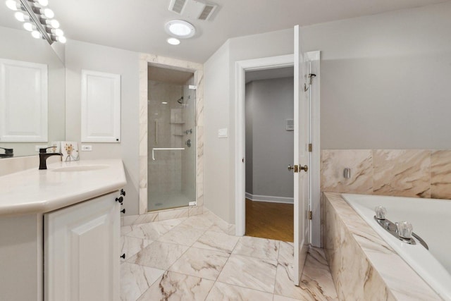 1424 Glencoe Ave, Highland Park, IL 60035 - full bath with vanity, a stall shower, a bath, baseboards, and marble look tiles