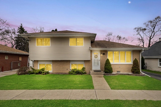 7011 Avon Ave, Oak Lawn, IL 60453 - split level home featuring brick siding and a front yard
