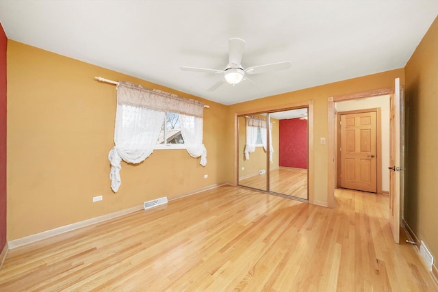 7011 Avon Ave, Oak Lawn, IL 60453 - unfurnished bedroom with light wood-type flooring, baseboards, a ceiling fan, and a closet