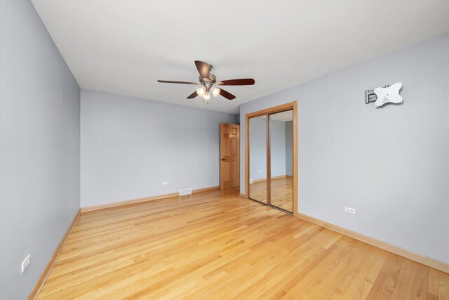 7011 Avon Ave, Oak Lawn, IL 60453 - unfurnished bedroom featuring wood finished floors, baseboards, a closet, and ceiling fan