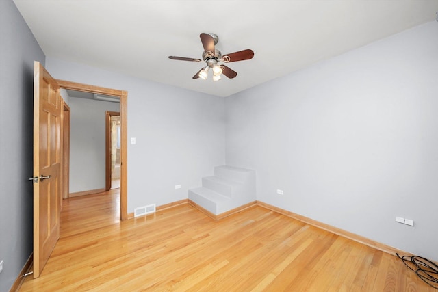 7011 Avon Ave, Oak Lawn, IL 60453 - unfurnished room with light wood-style floors, baseboards, and a ceiling fan