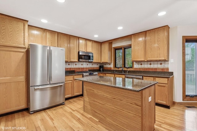 1021 Oxford St, Downers Grove, IL 60516 - kitchen featuring stainless steel appliances, light wood-style flooring, healthy amount of natural light, tasteful backsplash, and recessed lighting