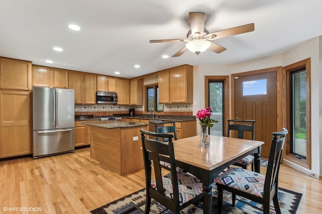 1021 Oxford St, Downers Grove, IL 60516 - kitchen featuring appliances with stainless steel finishes, light wood-style floors, backsplash, and recessed lighting
