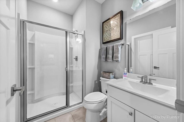 2093 Squire Cir, Yorkville, IL 60560 - full bathroom with toilet, vanity, a stall shower, and tile patterned flooring