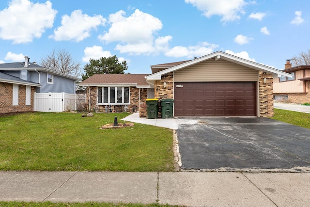 20054 Terrace Ave, Lynwood, IL 60411 - view of front facade featuring asphalt driveway, a garage, and brick siding