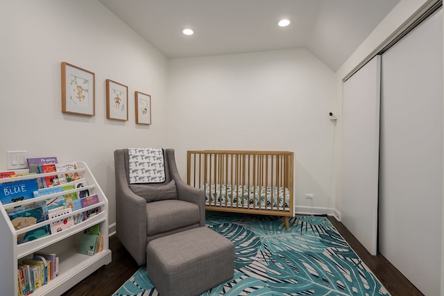 2117 W Dickens Ave, Chicago, IL 60647 - bedroom with wood finished floors, recessed lighting, a crib, vaulted ceiling, and a closet