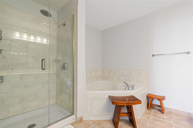 1515 S Prairie Ave Unit 1016, Chicago, IL 60605 - bathroom featuring a tub with jets, a stall shower, and tile patterned floors