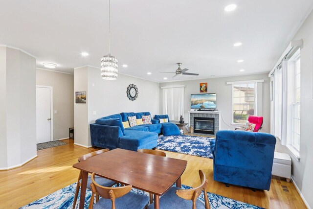 263 Thrush Cir, Lindenhurst, IL 60046 - living room featuring recessed lighting, wood finished floors, a ceiling fan, a fireplace, and baseboards