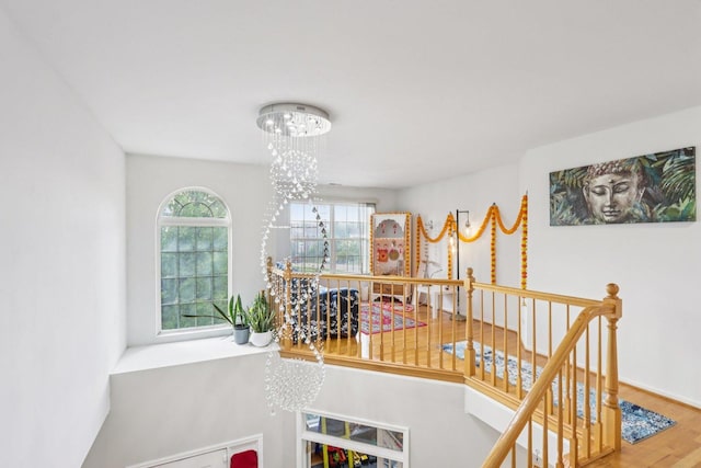 263 Thrush Cir, Lindenhurst, IL 60046 - staircase featuring a chandelier and wood finished floors