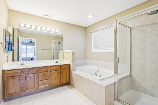 263 Thrush Cir, Lindenhurst, IL 60046 - bathroom featuring a garden tub, a shower stall, tile patterned floors, and double vanity