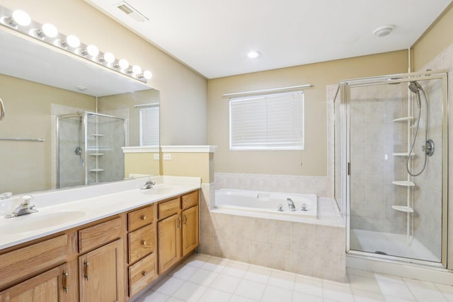 263 Thrush Cir, Lindenhurst, IL 60046 - full bath featuring a stall shower, a bath, double vanity, and tile patterned floors