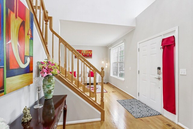 263 Thrush Cir, Lindenhurst, IL 60046 - foyer with wood finished floors, stairway, and baseboards