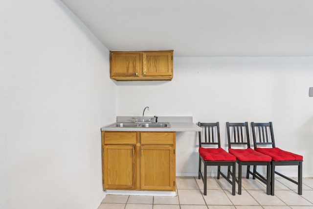 263 Thrush Cir, Lindenhurst, IL 60046 - bar area with a sink, light tile patterned flooring, and baseboards