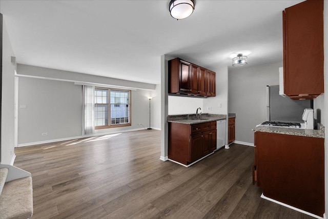 1330 Woodcutter Ln, Wheaton, IL 60189 - kitchen with white dishwasher, dark wood-style flooring, open floor plan, a sink, and baseboards