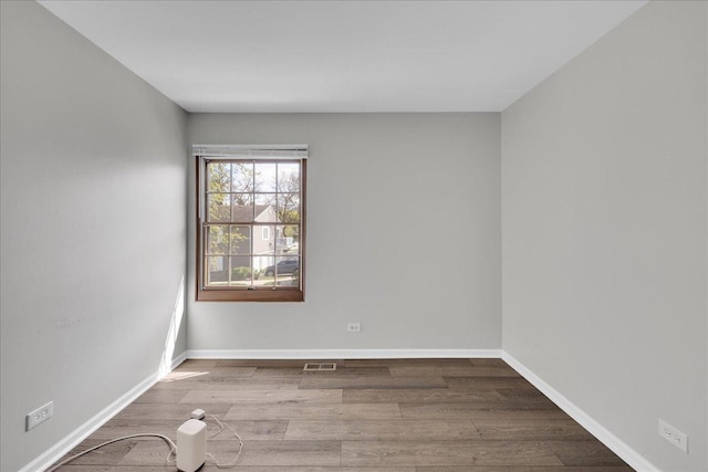 1330 Woodcutter Ln, Wheaton, IL 60189 - spare room featuring wood finished floors and baseboards