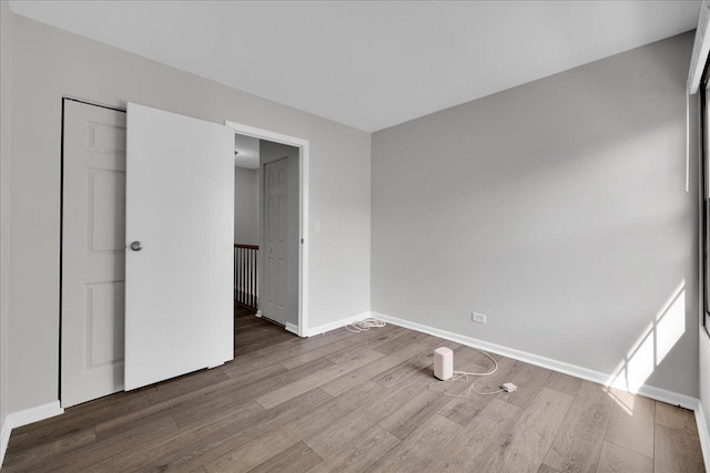 1330 Woodcutter Ln, Wheaton, IL 60189 - unfurnished bedroom featuring wood finished floors and baseboards