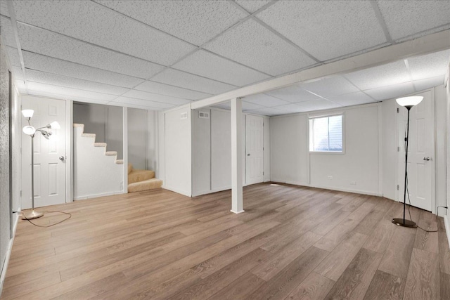 1330 Woodcutter Ln, Wheaton, IL 60189 - basement with wood finished floors, stairway, a drop ceiling, and baseboards