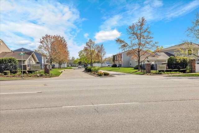 1330 Woodcutter Ln, Wheaton, IL 60189 - view of asphalt street featuring a residential view, curbs, and sidewalks