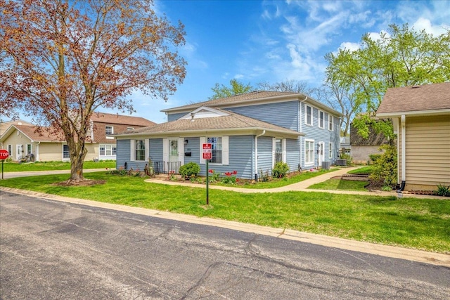 1330 Woodcutter Ln, Wheaton, IL 60189 - view of front of house with a front yard and central AC