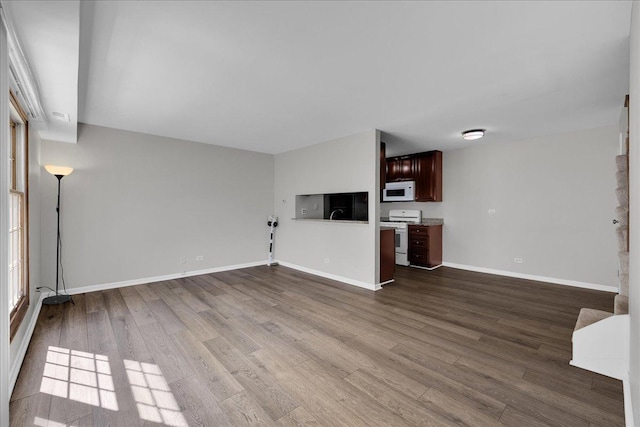 1330 Woodcutter Ln, Wheaton, IL 60189 - unfurnished living room featuring dark wood finished floors and baseboards