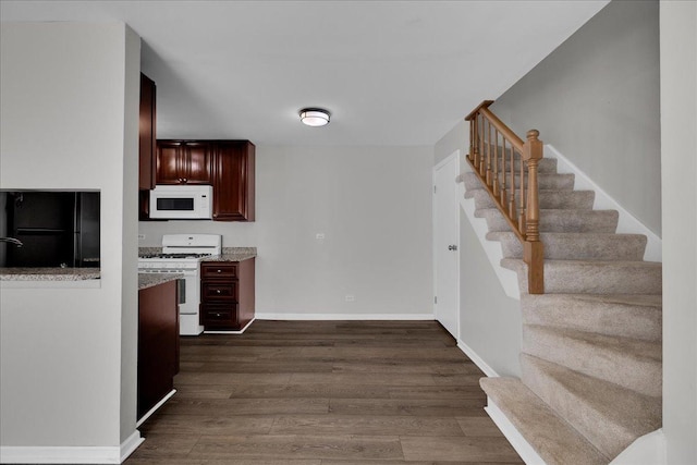 1330 Woodcutter Ln, Wheaton, IL 60189 - kitchen with white appliances, dark wood-type flooring, baseboards, and reddish brown cabinets