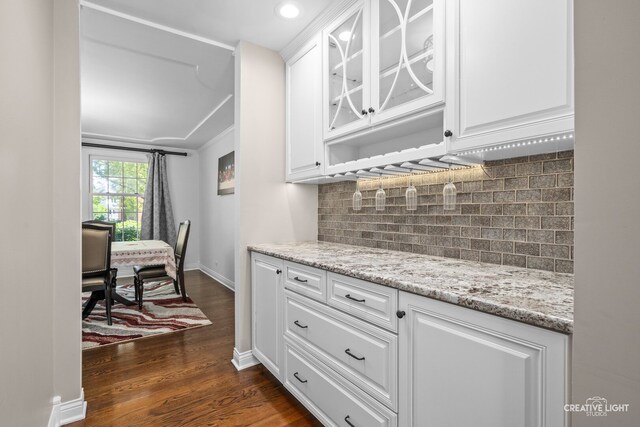 2417 Wentworth Ln, Aurora, IL 60502 - kitchen with glass insert cabinets, dark wood finished floors, white cabinetry, tasteful backsplash, and recessed lighting