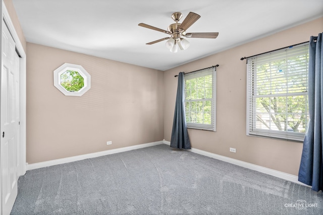 2417 Wentworth Ln, Aurora, IL 60502 - unfurnished bedroom with carpet, baseboards, a closet, and a ceiling fan