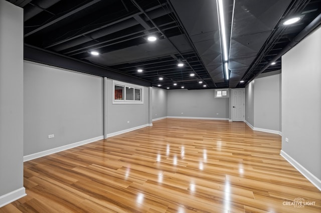 2417 Wentworth Ln, Aurora, IL 60502 - finished below grade area with light wood finished floors and baseboards