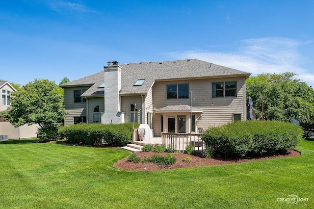 2417 Wentworth Ln, Aurora, IL 60502 - rear view of house with a yard, a patio area, a shingled roof, and a chimney