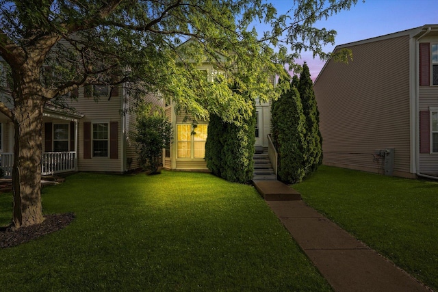46 Harmony Ln, Romeoville, IL 60446 - yard at dusk featuring a yard