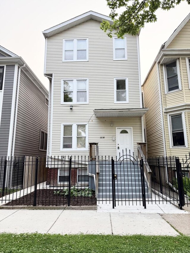 3238 N Whipple St, Chicago, IL 60618 - multi unit property featuring a fenced front yard