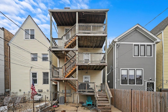 3238 N Whipple St, Chicago, IL 60618 - back of house with stairs, a fenced backyard, and a wooden deck