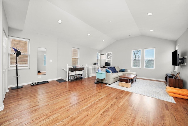 3238 N Whipple St, Chicago, IL 60618 - living room featuring plenty of natural light, wood finished floors, recessed lighting, vaulted ceiling, and baseboards