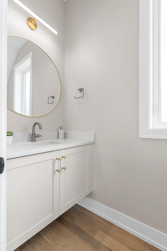 1636 W Wolfram St, Chicago, IL 60657 - bathroom with vanity, wood finished floors, and baseboards