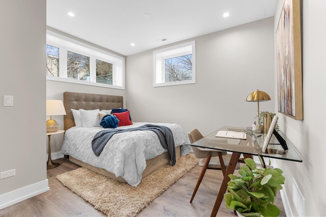 1636 W Wolfram St, Chicago, IL 60657 - bedroom with wood finished floors, baseboards, and recessed lighting