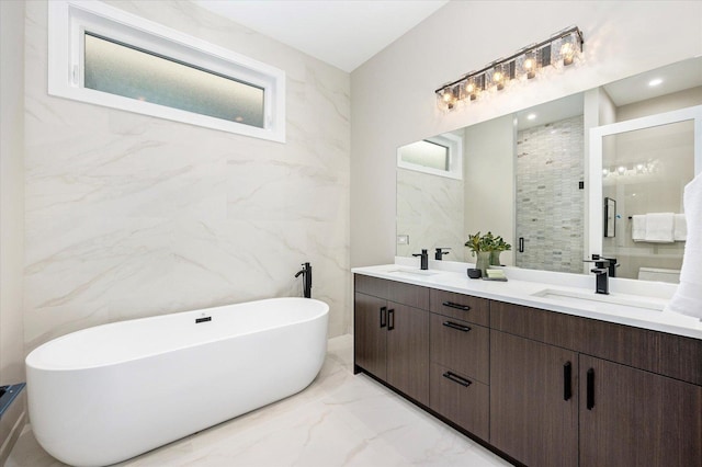 1636 W Wolfram St, Chicago, IL 60657 - full bath with marble tiled floors, double vanity, a freestanding bath, and tile walls