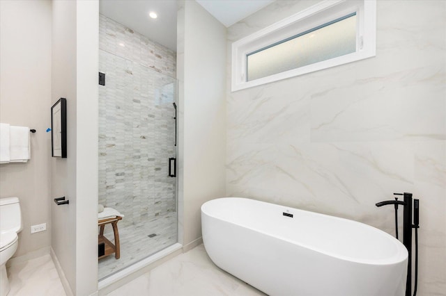 1636 W Wolfram St, Chicago, IL 60657 - bathroom featuring marble finish floors, toilet, a freestanding bath, a shower stall, and baseboards