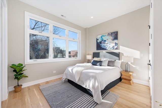 1636 W Wolfram St, Chicago, IL 60657 - bedroom with wood finished floors, baseboards, and recessed lighting