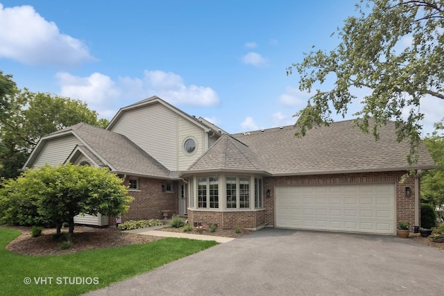 13922 Steepleview Ln, Lemont, IL 60439 - view of front of property featuring brick siding, driveway, an attached garage, and roof with shingles