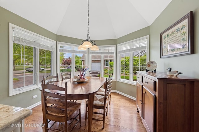 13922 Steepleview Ln, Lemont, IL 60439 - dining area with vaulted ceiling and light wood-style floors