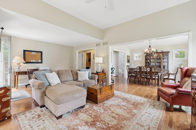 13922 Steepleview Ln, Lemont, IL 60439 - living area featuring light wood-style flooring, a chandelier, and a ceiling fan