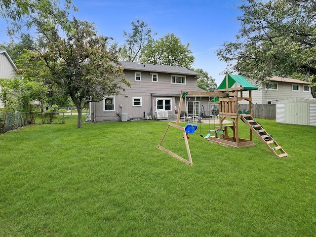 4400 Waubansie Ln, Lisle, IL 60532 - back of property with a playground, a fenced backyard, and a storage shed