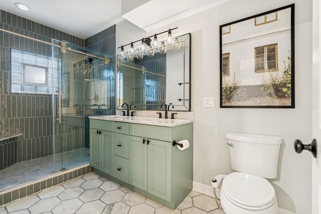 2309 W Chicago Ave Unit 1, Chicago, IL 60622 - full bath with toilet, tile patterned flooring, double vanity, a shower stall, and baseboards