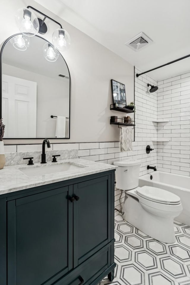 2309 W Chicago Ave Unit 1, Chicago, IL 60622 - full bath featuring tile walls, toilet, vanity, and shower / tub combination