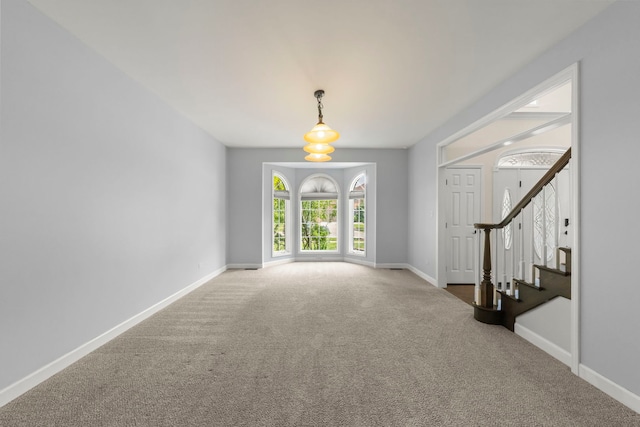 499 Waubonsee Cir, Oswego, IL 60543 - entryway with carpet, baseboards, and stairs